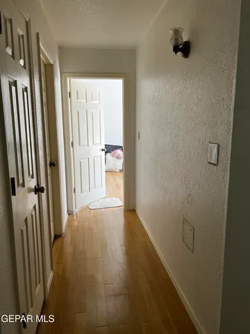 a walk in closet with a cabinet