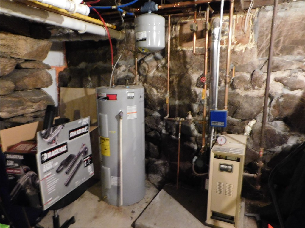 22 Douglas Street West Warwick, RI 02893 - Photo 20 of 50 Basement unit # 22 furnace and water tank.