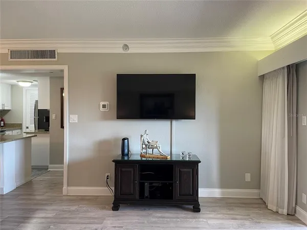 a living room with a couch and a flat screen tv