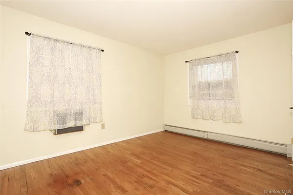 a view of walk in closet with clothes