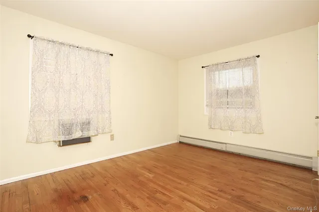 a view of walk in closet with clothes