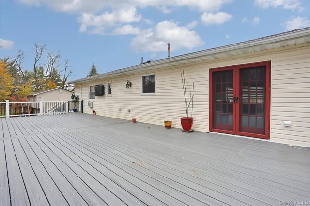 a view of a deck with large trees