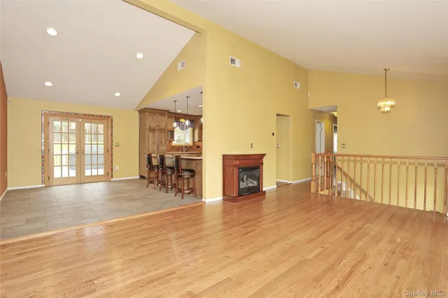 a view of a livingroom with furniture wooden floor and window