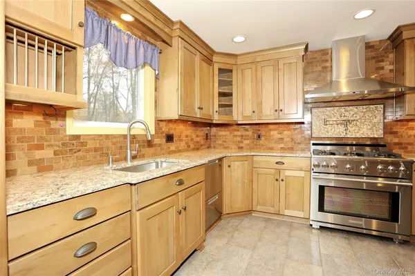 a kitchen with stainless steel appliances a refrigerator sink and cabinets