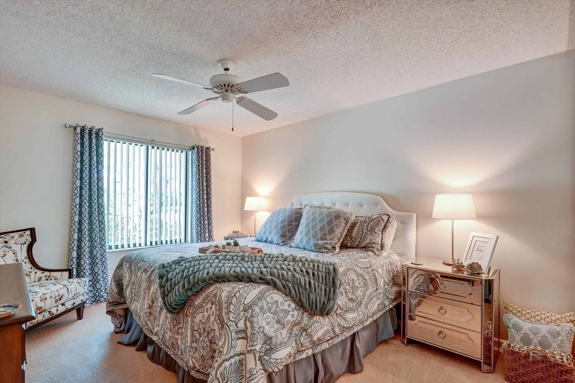 316 River Edge Road Jupiter, FL 33477 - Photo 11 of 53 a bedroom with a bed and window