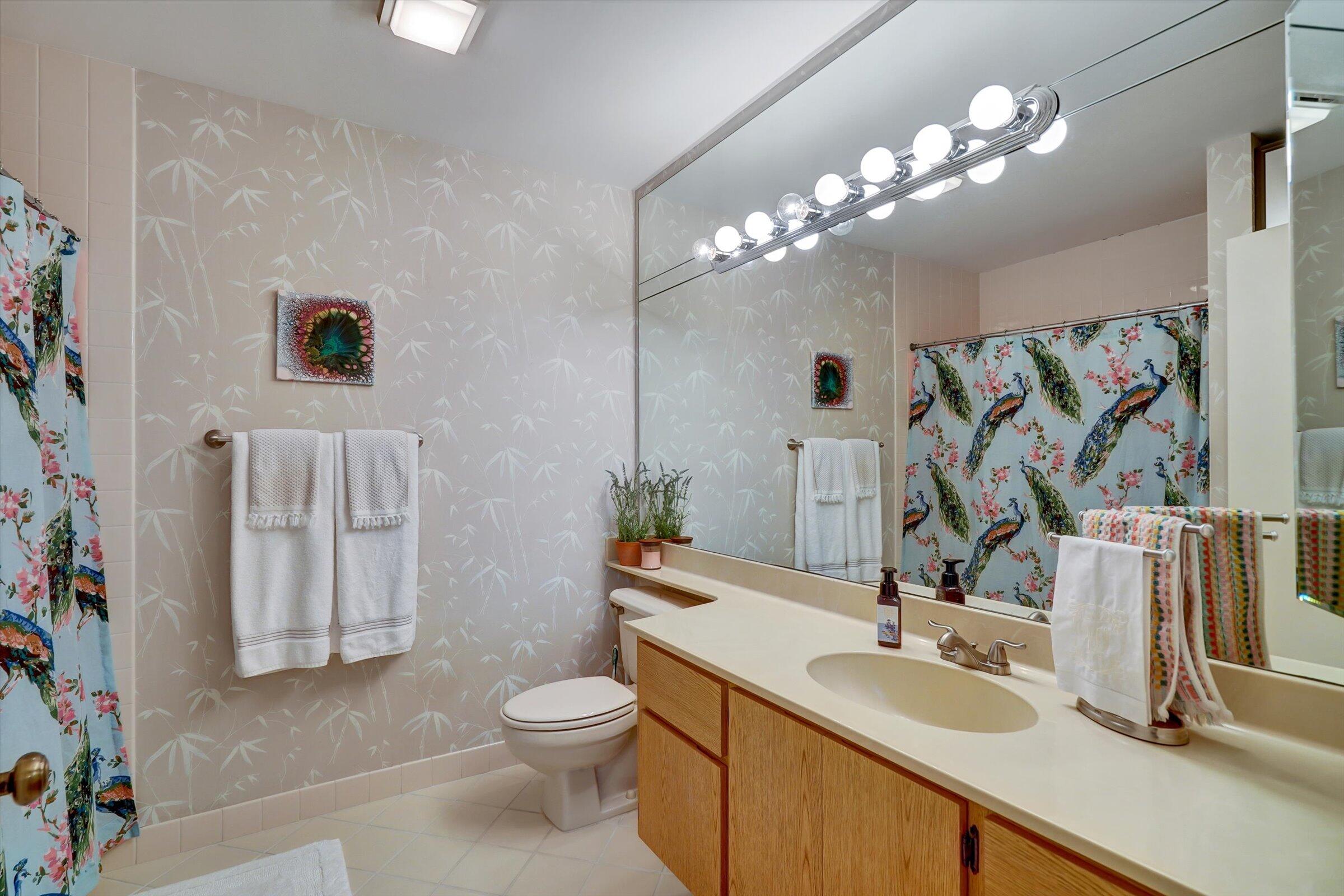 316 River Edge Road Jupiter, FL 33477 - Photo 13 of 53 a bathroom with a toilet sink and mirror