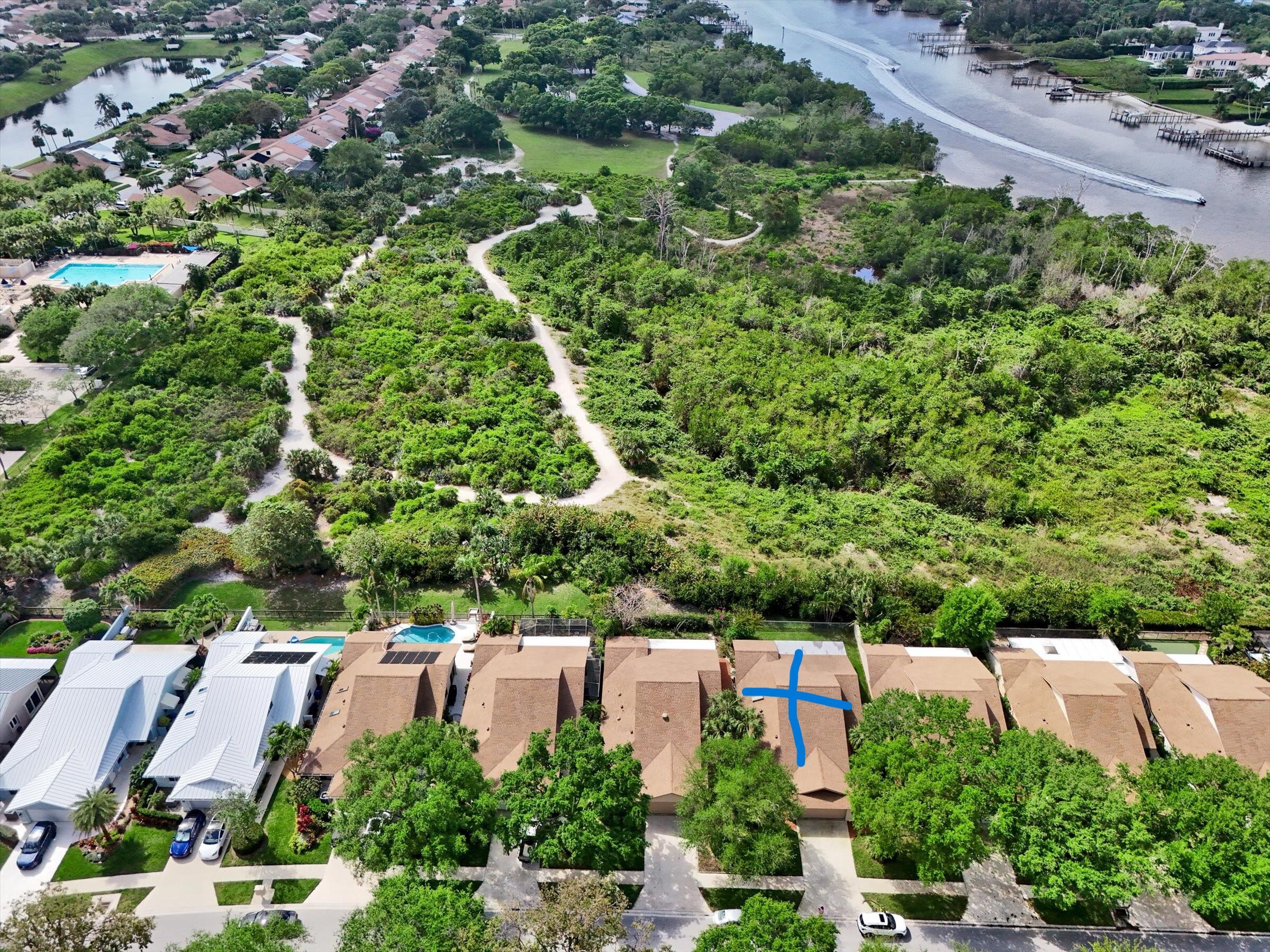 316 River Edge Road Jupiter, FL 33477 - Photo 14 of 53 an aerial view of residential house with outdoor space and trees all around
