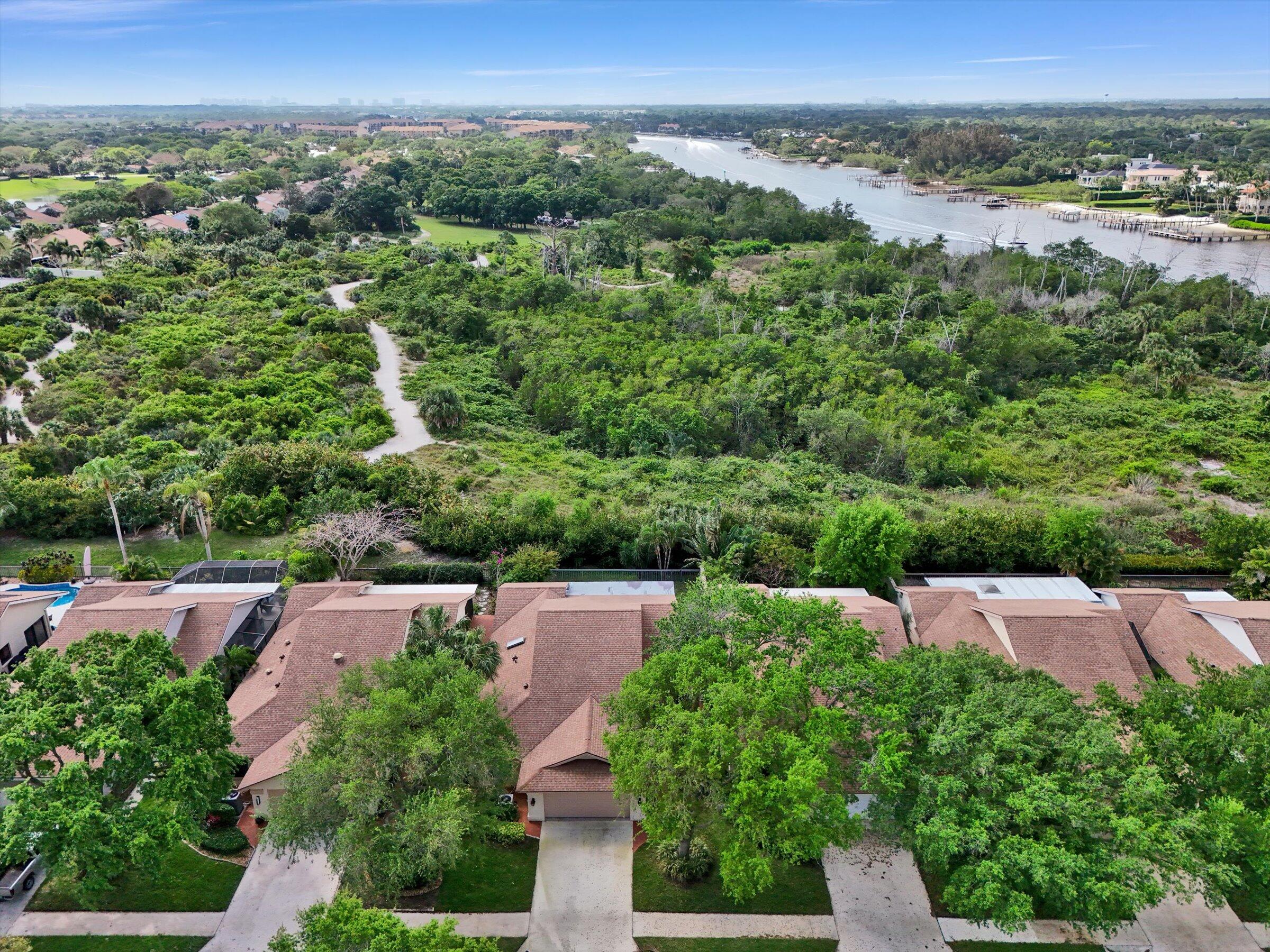 316 River Edge Road Jupiter, FL 33477 - Photo 32 of 53 an aerial view of a city with lots of residential buildings