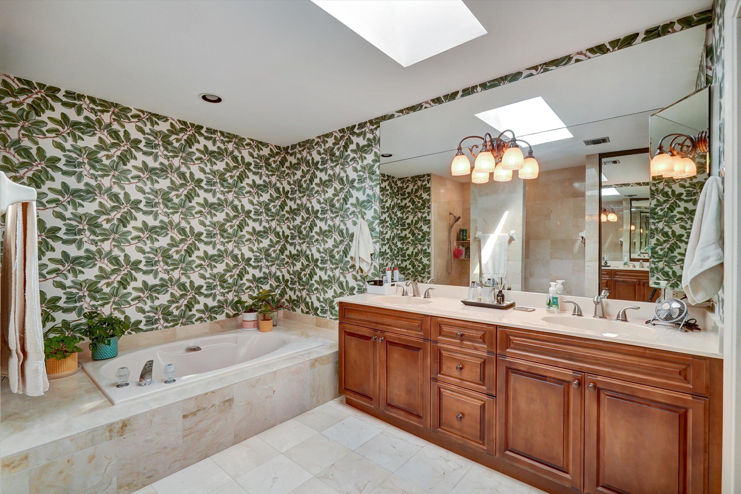 316 River Edge Road Jupiter, FL 33477 - Photo 38 of 53 a bathroom with a double vanity sink mirror and bathtub