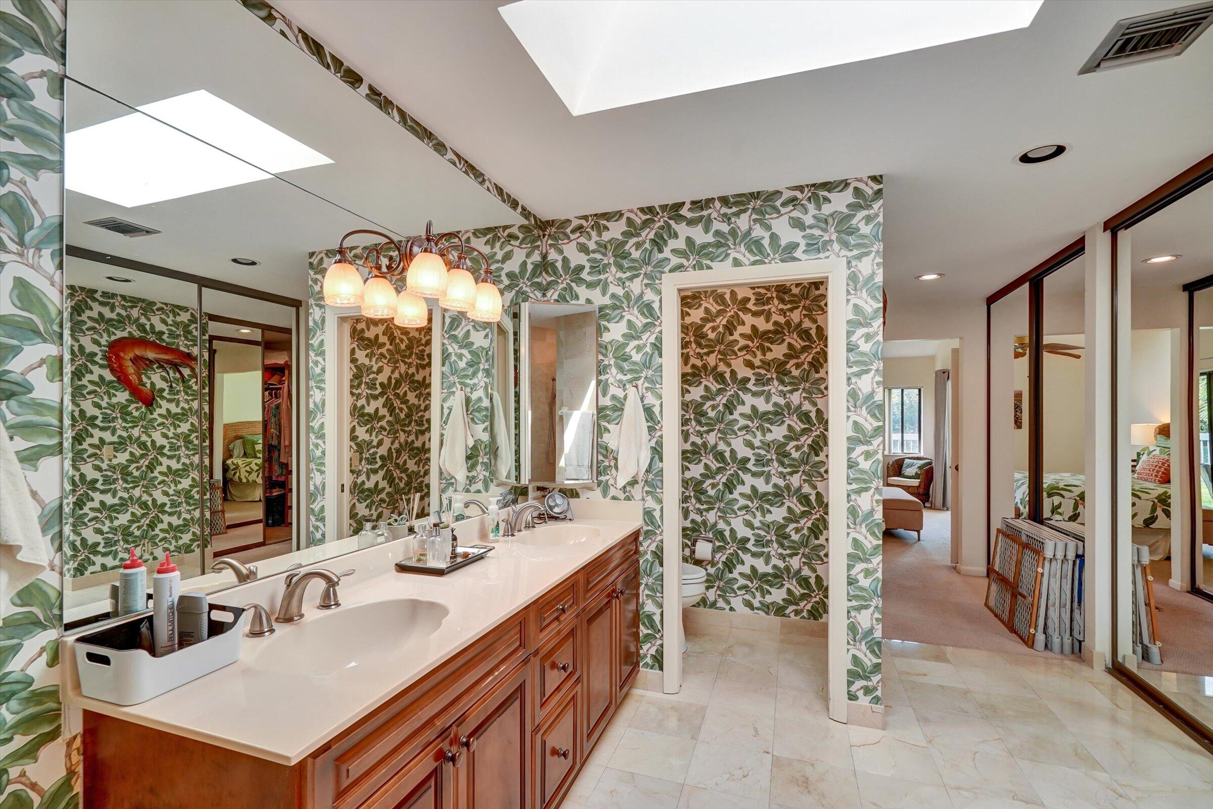 316 River Edge Road Jupiter, FL 33477 - Photo 39 of 53 a bathroom with a double vanity sink mirror and shower