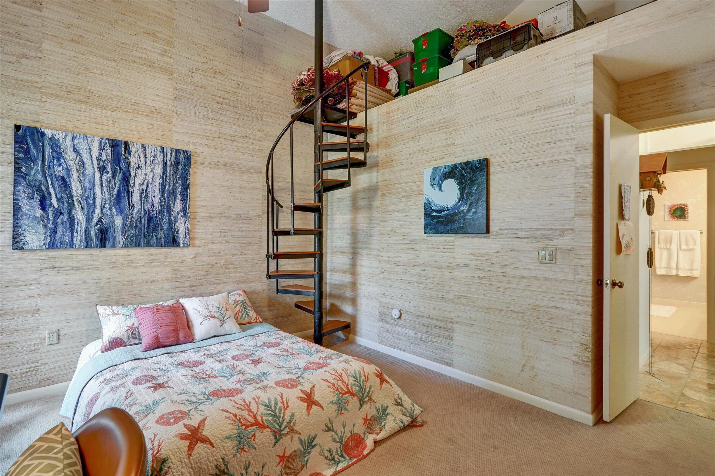 316 River Edge Road Jupiter, FL 33477 - Photo 42 of 53 a bedroom with a bed and a painting on the wall