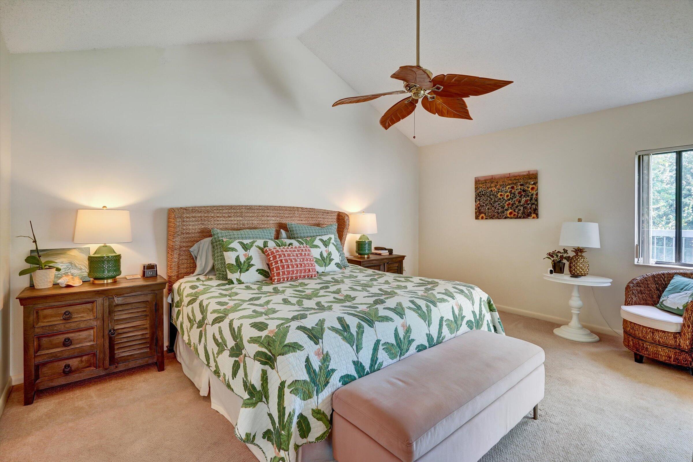 316 River Edge Road Jupiter, FL 33477 - Photo 9 of 53 a bedroom with a bed and ceiling fan
