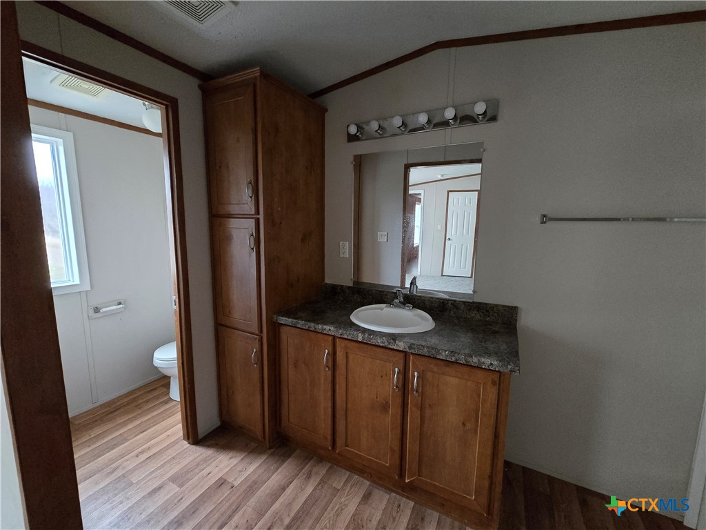 1911 Wald Road, Unit 9 New Braunfels, TX 78132 - Photo 11 of 14 a bathroom with a sink and a mirror