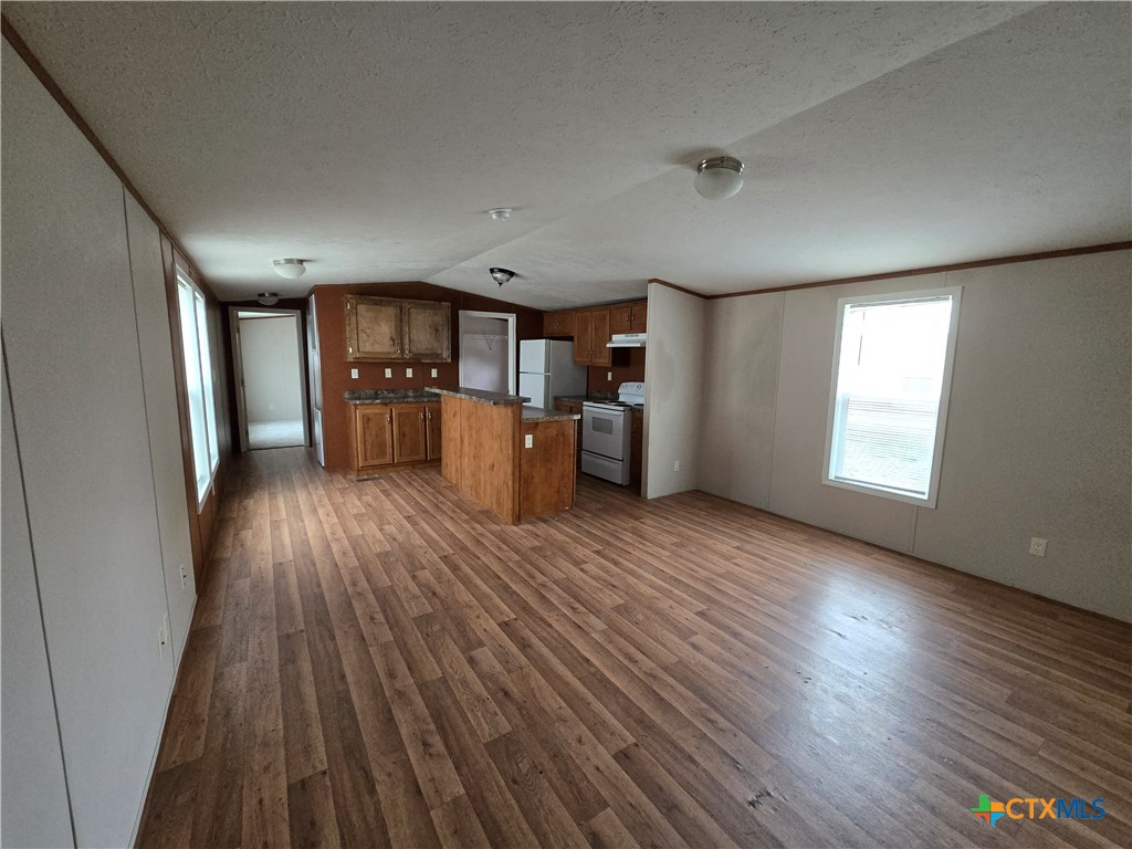 1911 Wald Road, Unit 9 New Braunfels, TX 78132 - Photo 2 of 14 a view of a kitchen with wooden floor