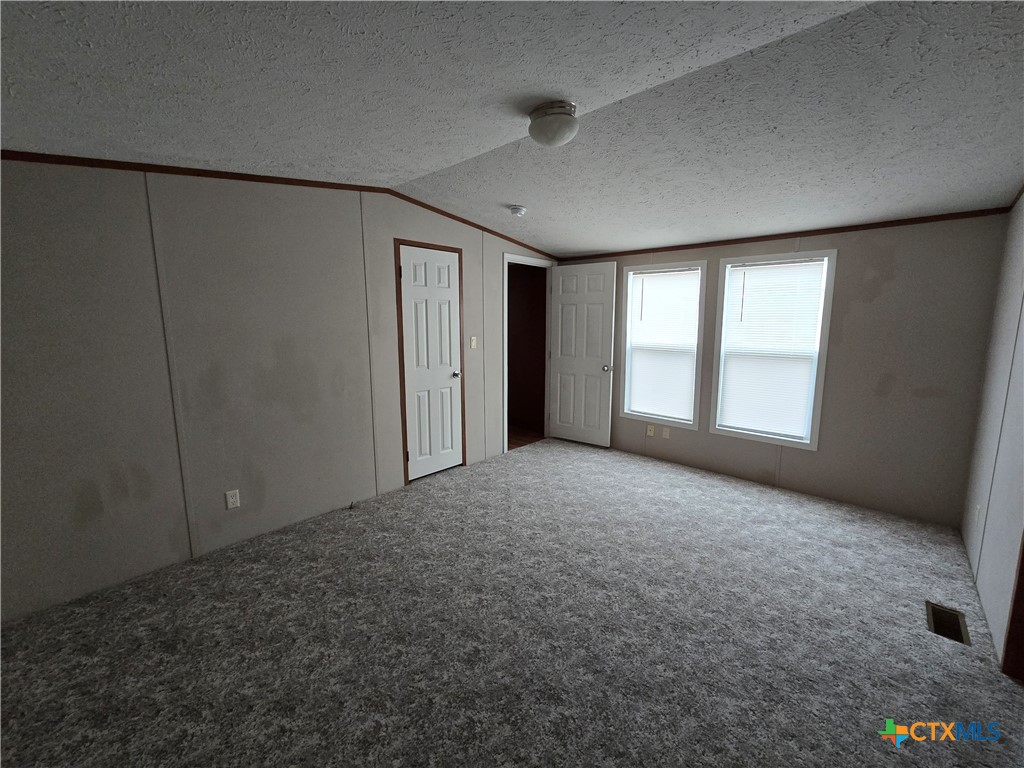 1911 Wald Road, Unit 9 New Braunfels, TX 78132 - Photo 9 of 14 a view of an empty room with a window