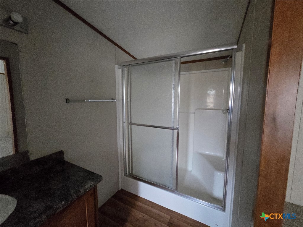 1911 Wald Road, Unit 9 New Braunfels, TX 78132 - Photo 10 of 14 a kitchen with a refrigerator and a stove top oven