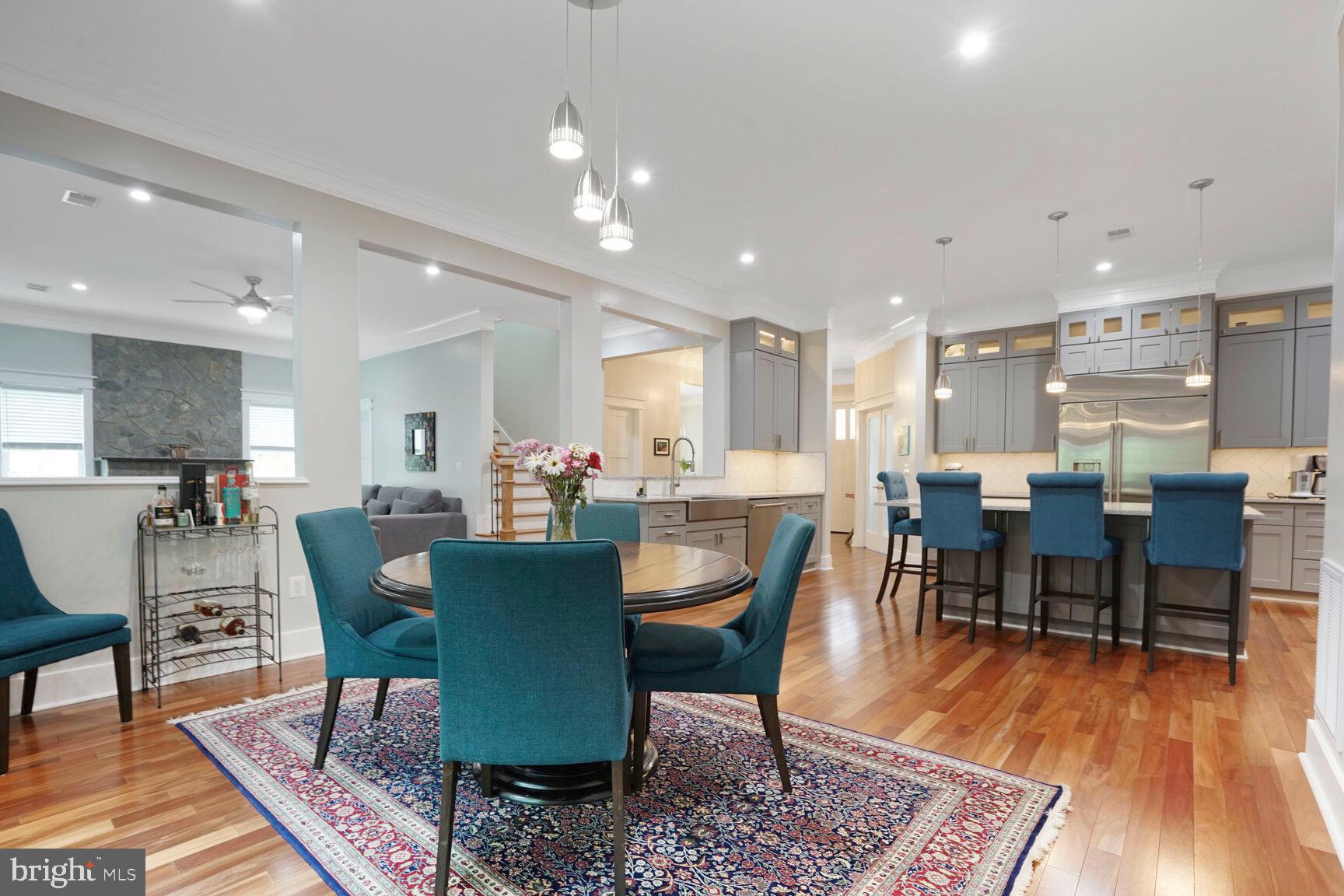 7045 Barbara Road Alexandria, VA 22315 - Photo 14 of 57 a view of a dining room with furniture wooden floor and a rug