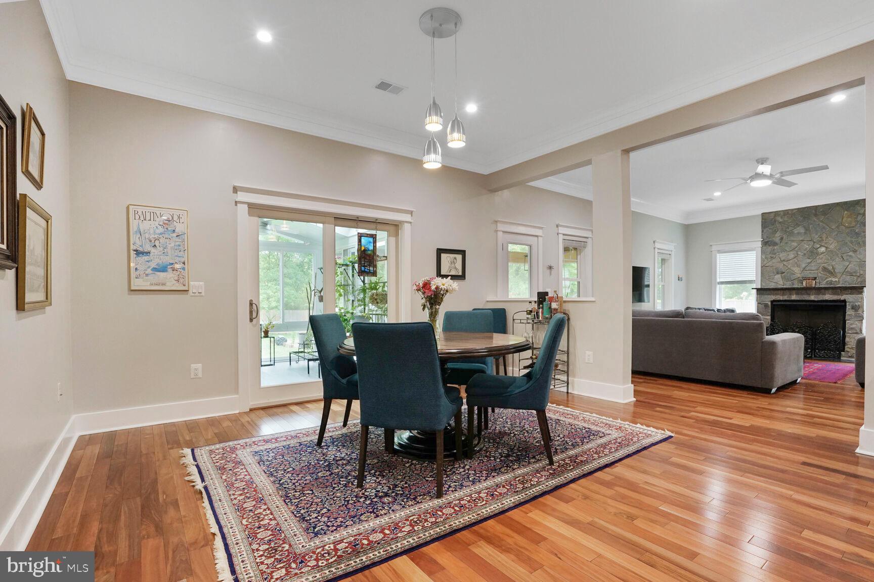 7045 Barbara Road Alexandria, VA 22315 - Photo 15 of 57 a view of a dining room with furniture a rug and wooden floor