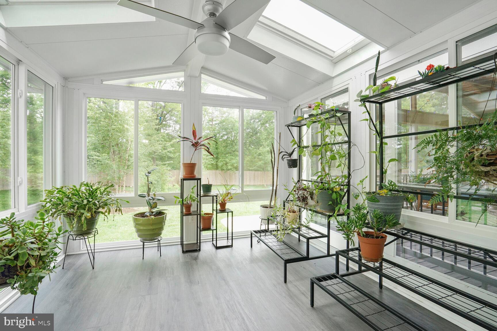7045 Barbara Road Alexandria, VA 22315 - Photo 16 of 57 a living room with furniture and a large window with wooden floor