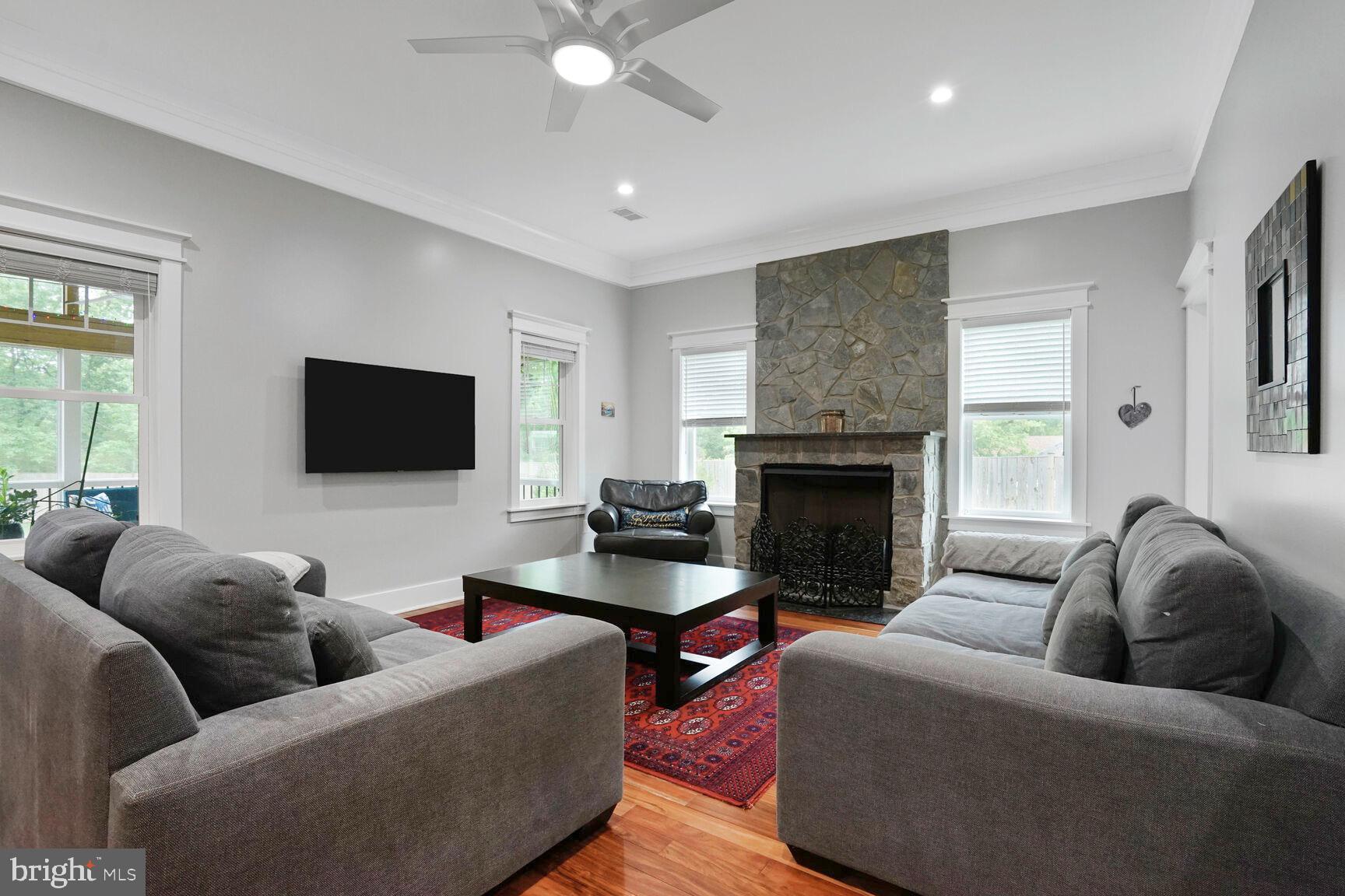 7045 Barbara Road Alexandria, VA 22315 - Photo 18 of 57 a living room with furniture and a fireplace