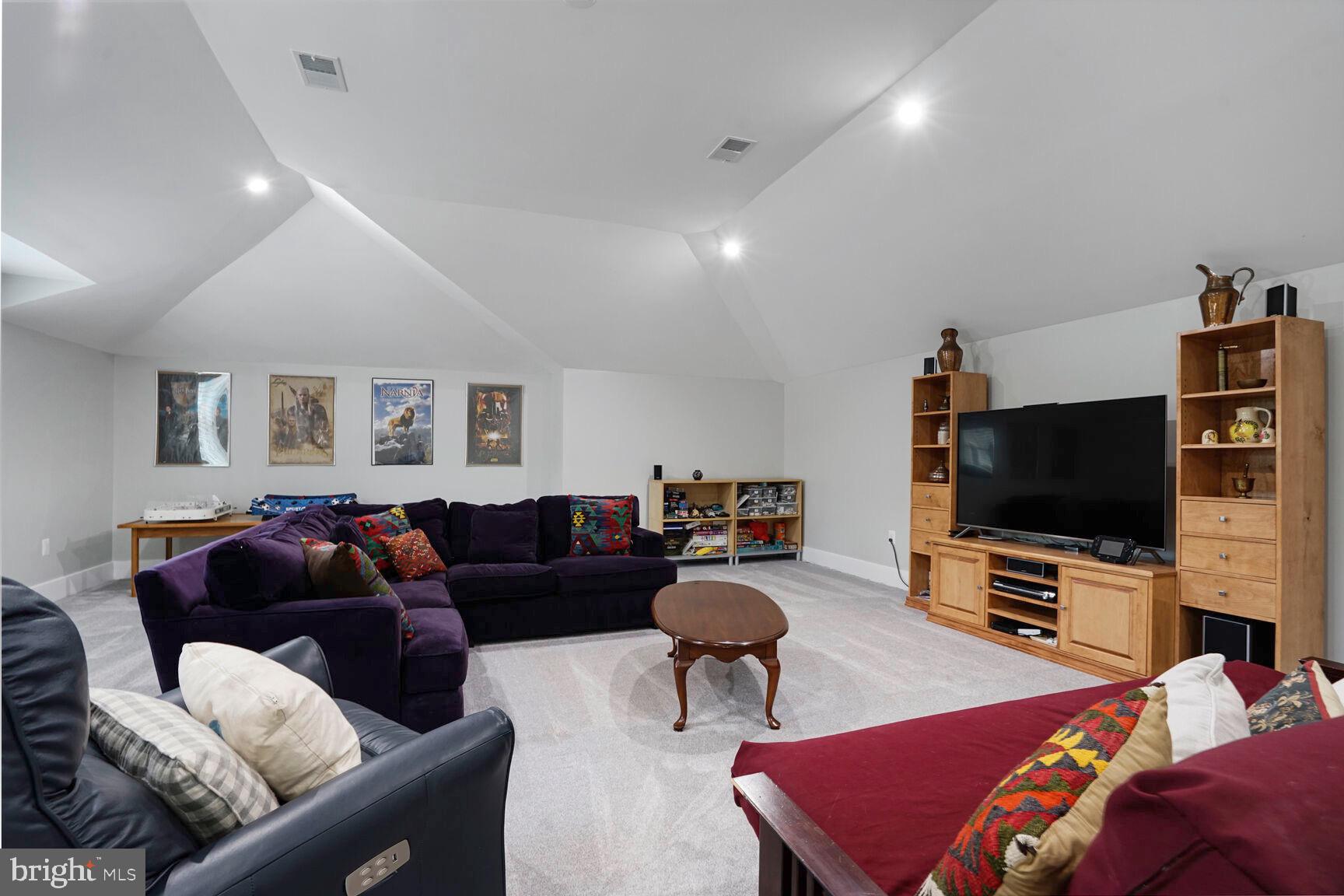 7045 Barbara Road Alexandria, VA 22315 - Photo 26 of 57 a living room with furniture and a flat screen tv