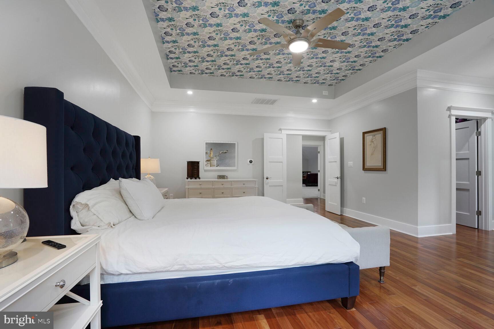 7045 Barbara Road Alexandria, VA 22315 - Photo 30 of 57 a bed room with a bed and a chandelier