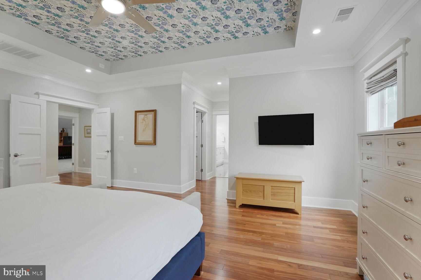 7045 Barbara Road Alexandria, VA 22315 - Photo 31 of 57 a bedroom with a bed and wooden floor