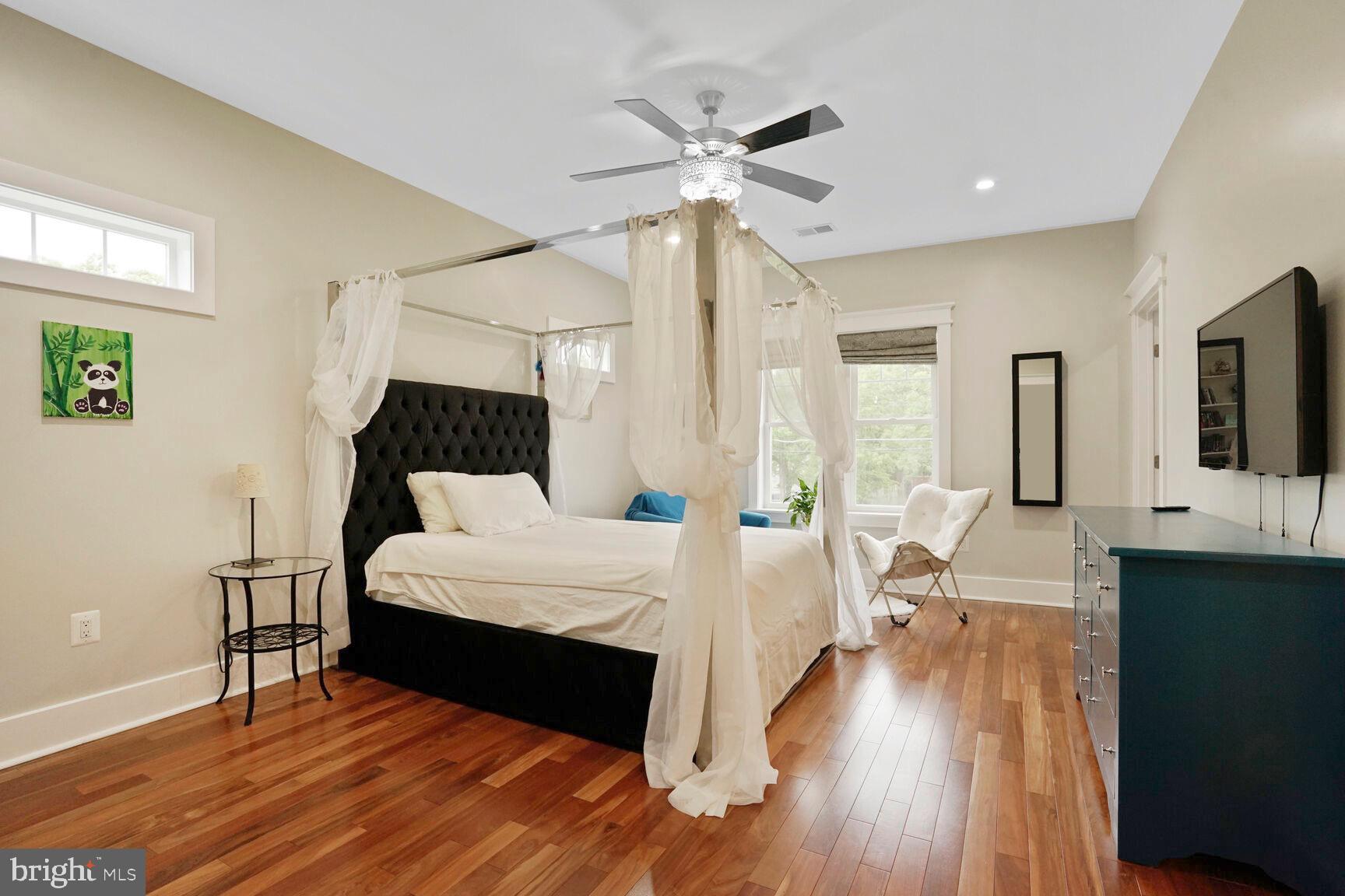 7045 Barbara Road Alexandria, VA 22315 - Photo 35 of 57 a bed room with a bed and a chandelier