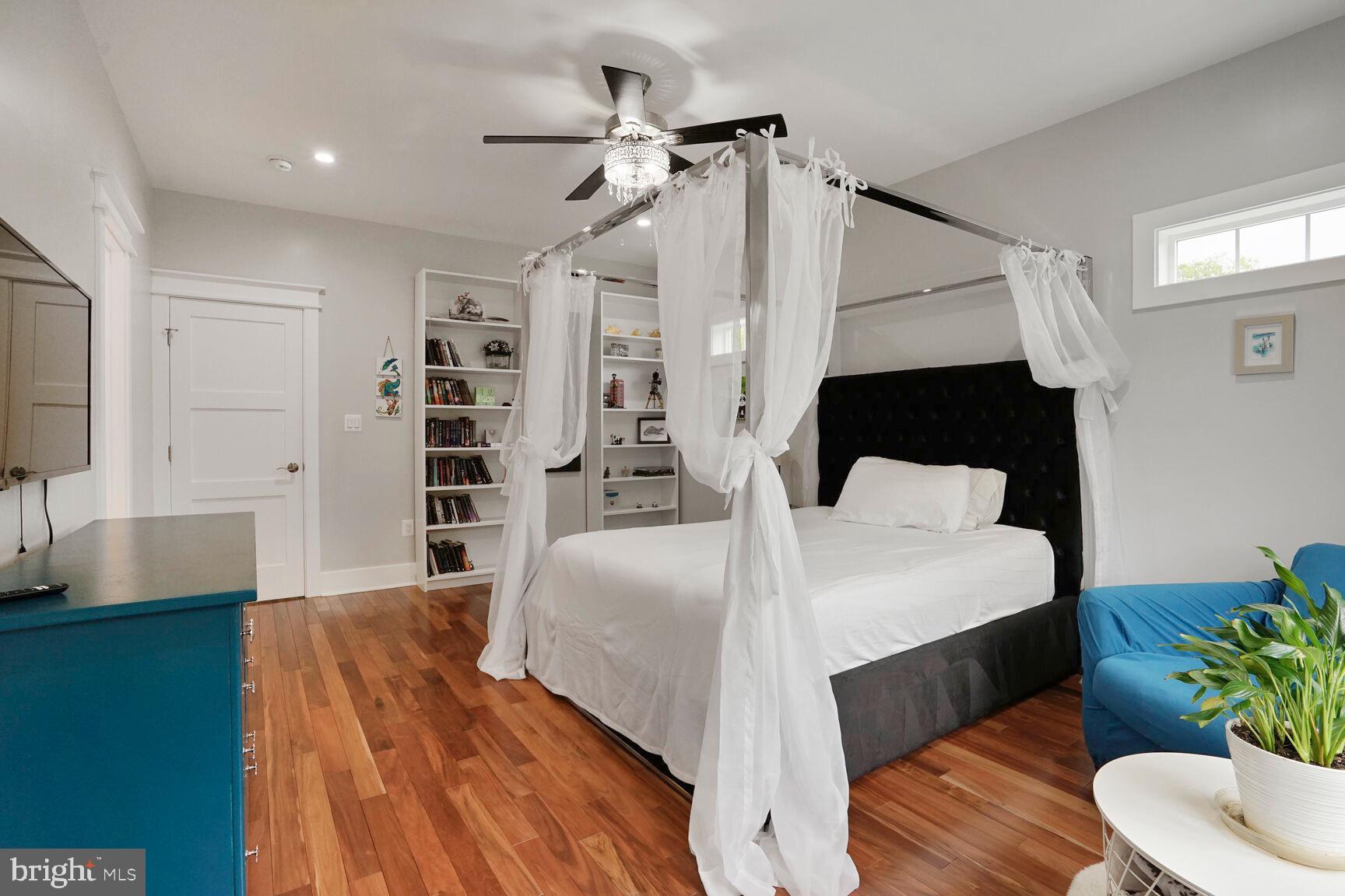 7045 Barbara Road Alexandria, VA 22315 - Photo 36 of 57 a bedroom with a bed a mirror and furniture