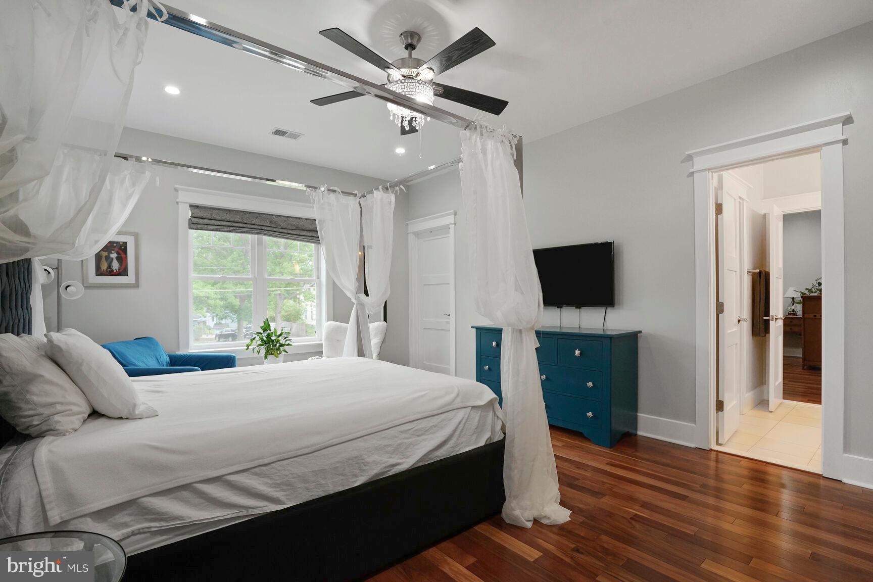 7045 Barbara Road Alexandria, VA 22315 - Photo 37 of 57 a bedroom with a bed and a flat screen tv