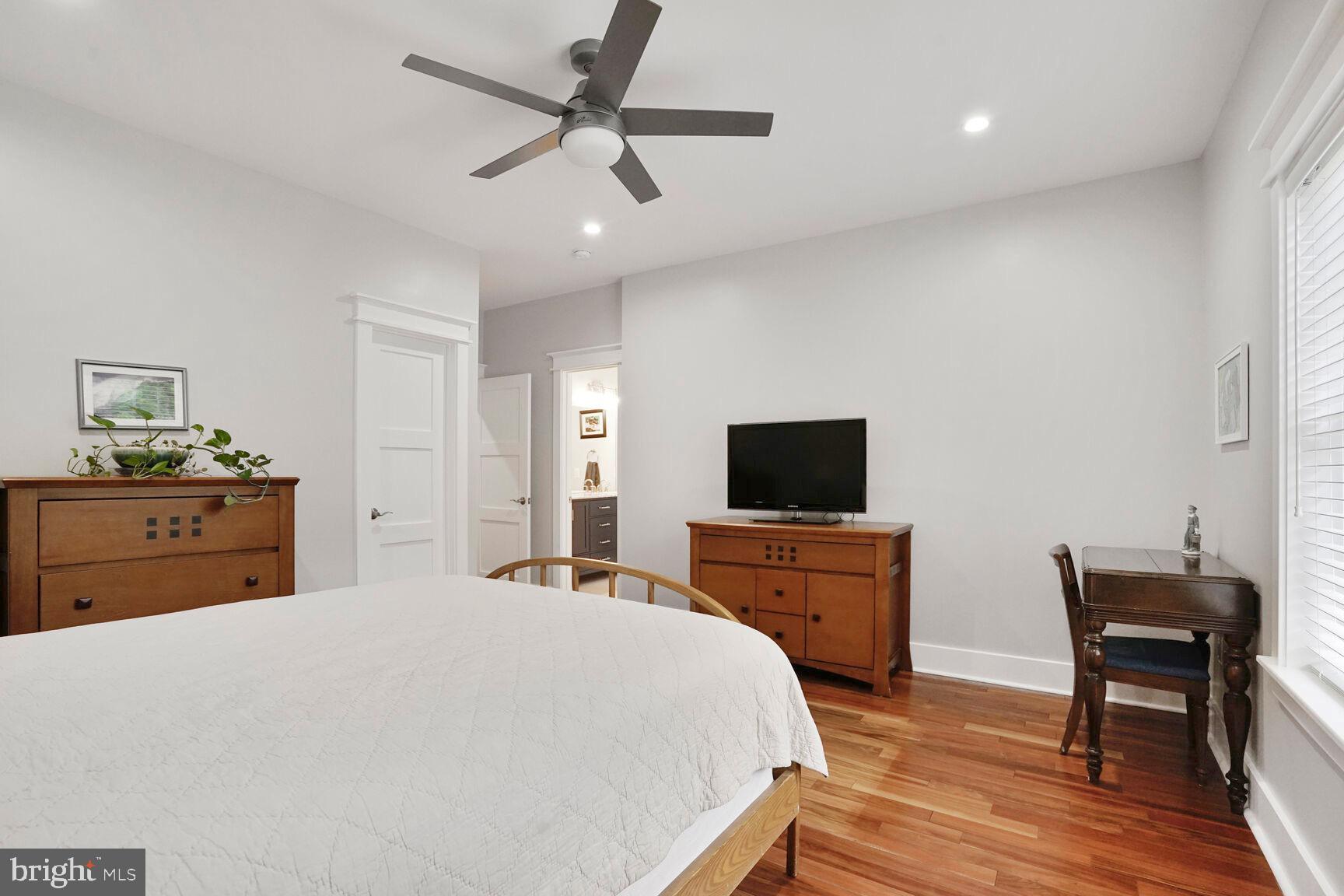 7045 Barbara Road Alexandria, VA 22315 - Photo 41 of 57 a bedroom with a bed and a flat screen tv