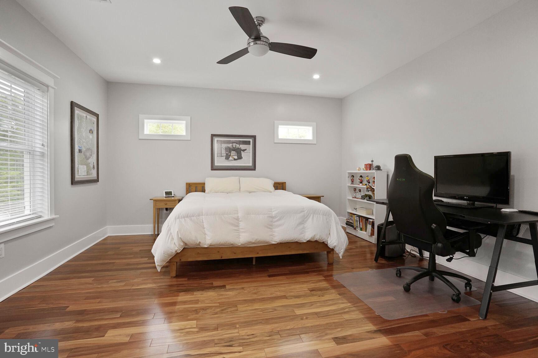 7045 Barbara Road Alexandria, VA 22315 - Photo 43 of 57 a spacious bedroom with a bed and a desk