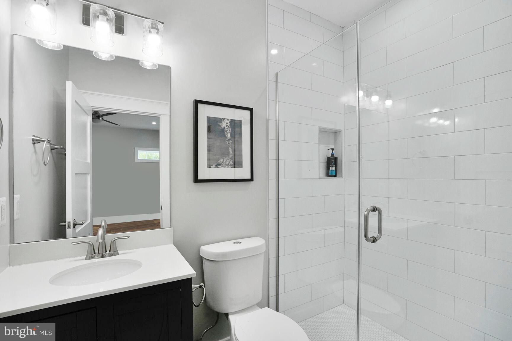 7045 Barbara Road Alexandria, VA 22315 - Photo 45 of 57 a bathroom with a sink toilet and shower