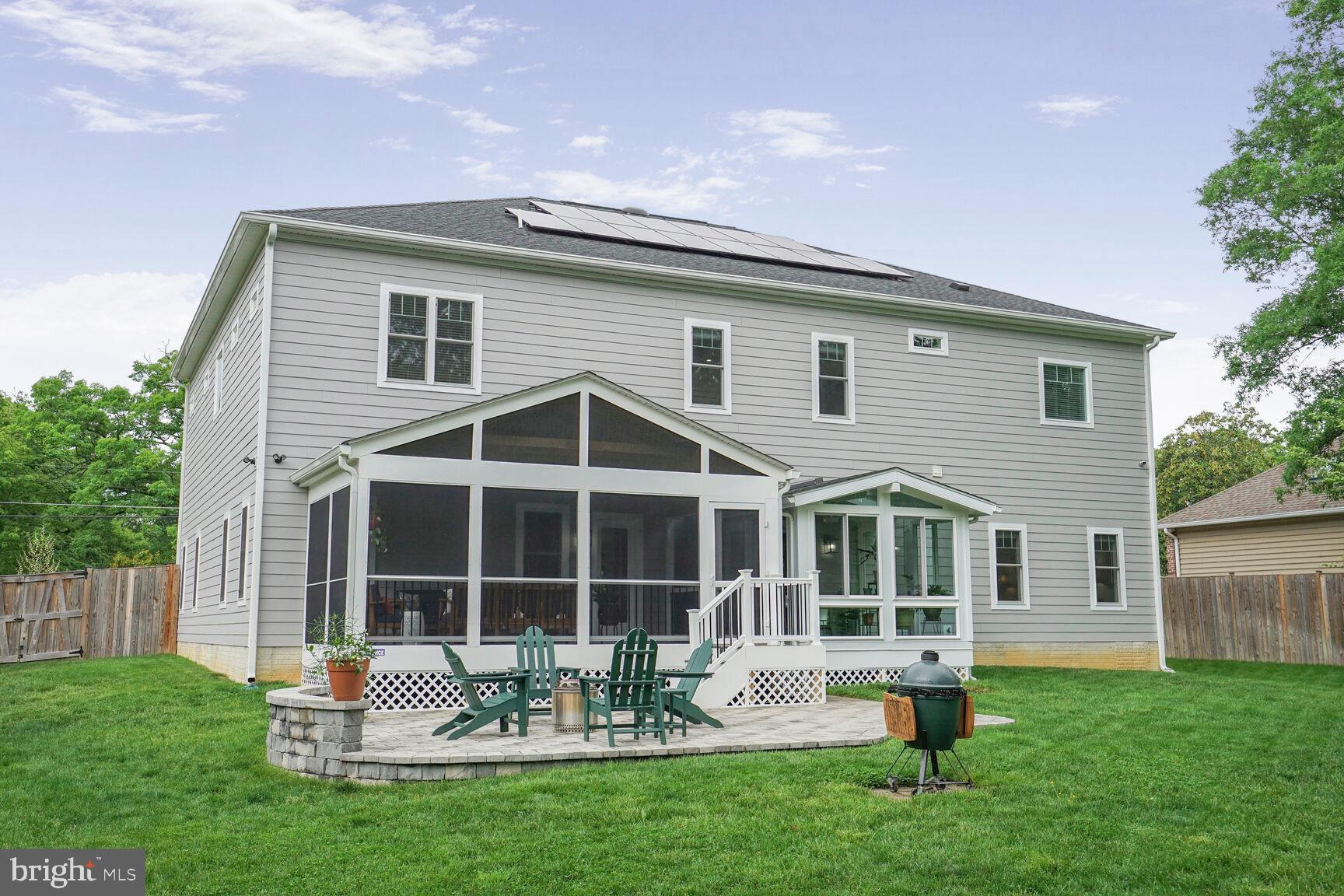 7045 Barbara Road Alexandria, VA 22315 - Photo 48 of 57 a backyard of a house with table and chairs