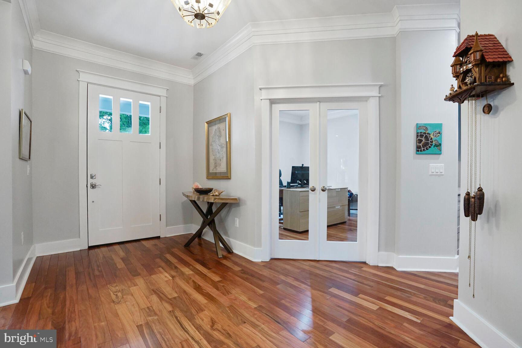 7045 Barbara Road Alexandria, VA 22315 - Photo 5 of 57 a view of a room with wooden floor and a ceiling fan
