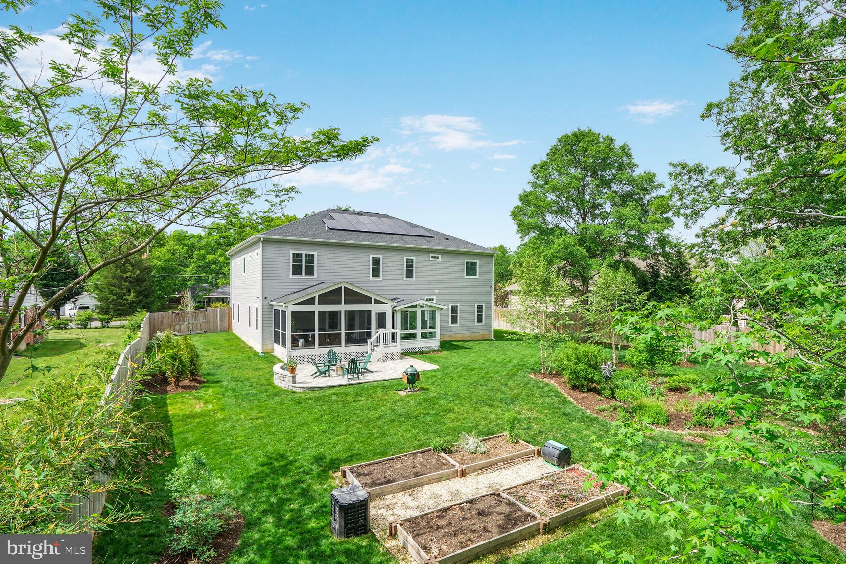7045 Barbara Road Alexandria, VA 22315 - Photo 53 of 57 aerial view of a house with a yard table and chairs