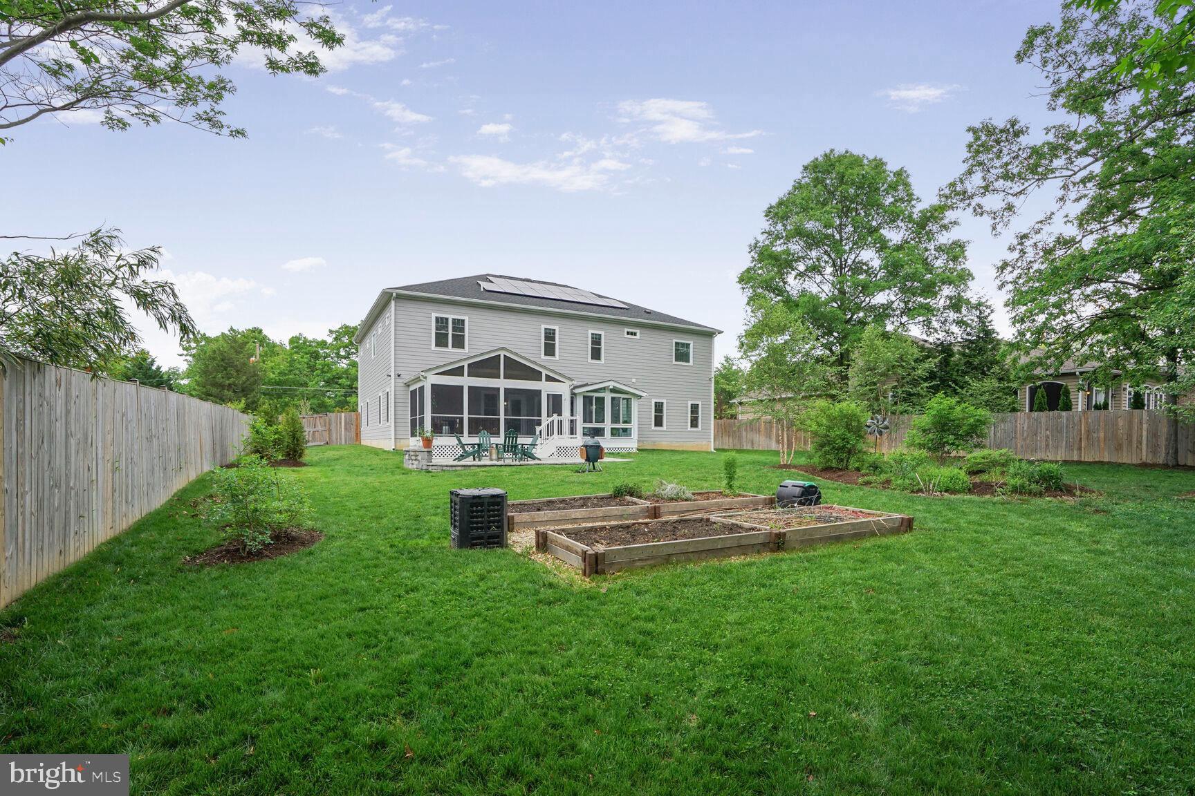 7045 Barbara Road Alexandria, VA 22315 - Photo 54 of 57 a front view of a house with a yard table and chairs