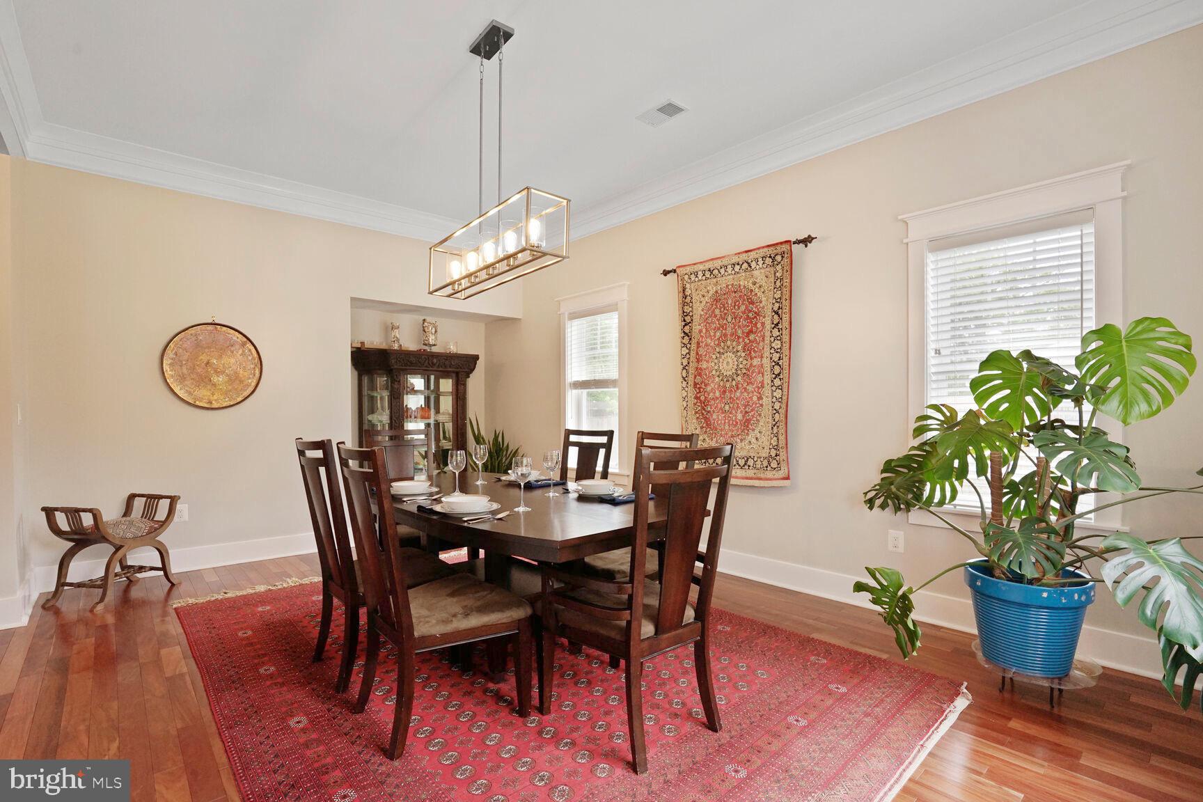 7045 Barbara Road Alexandria, VA 22315 - Photo 6 of 57 a view of a dining room with furniture window and wooden floor
