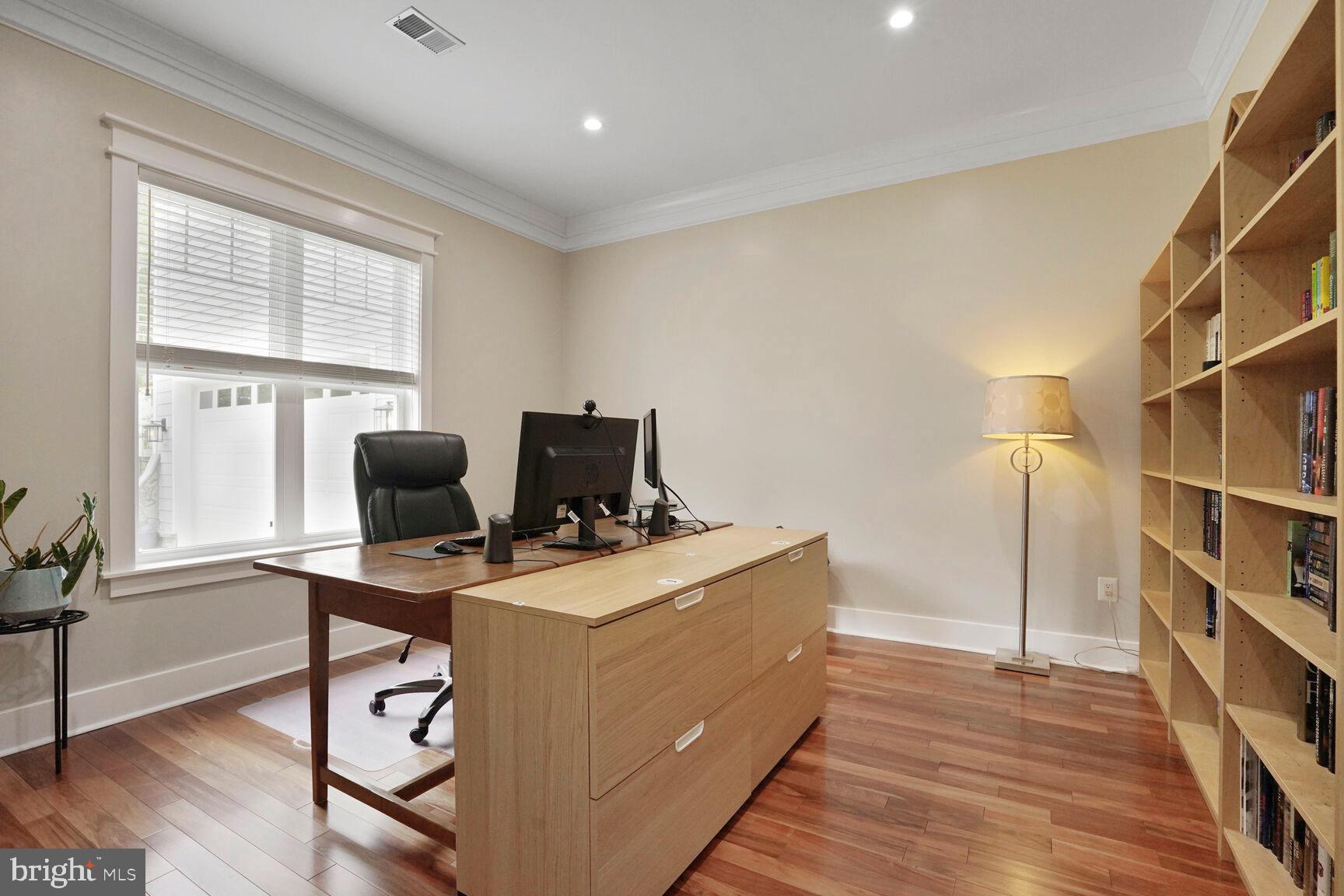 7045 Barbara Road Alexandria, VA 22315 - Photo 8 of 57 a view of a workspace with furniture and a window