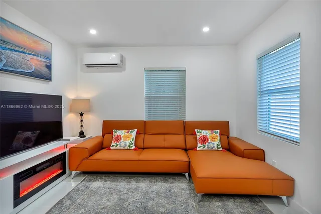 a living room with furniture and a couch