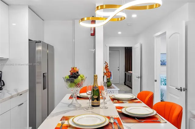 a bedroom with a bed and painting on the wall