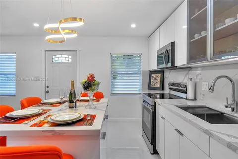 a bathroom with a toilet a sink and shower