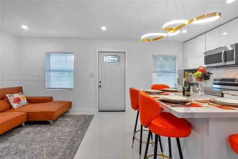 a bedroom with a bed couch and window