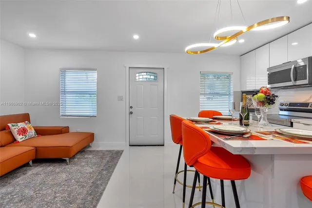 a bedroom with a bed couch and window