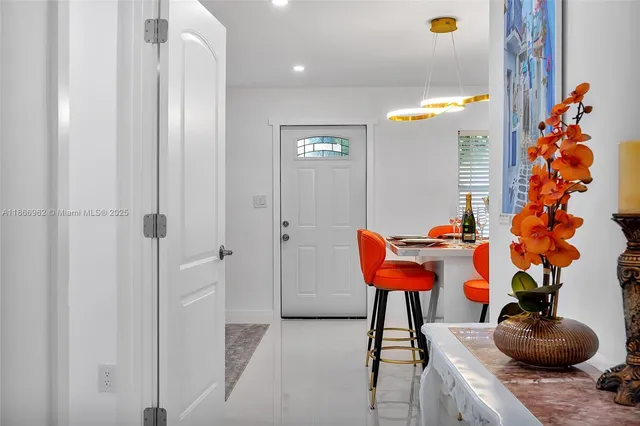 a bedroom with a bed couch and cabinets