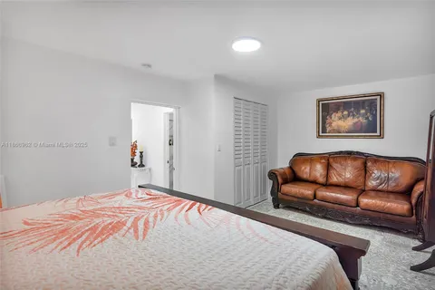 a kitchen with stainless steel appliances granite countertop a sink refrigerator and cabinets