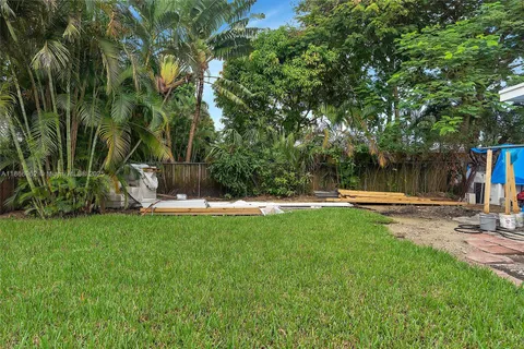 a bedroom with a bed and cabinets