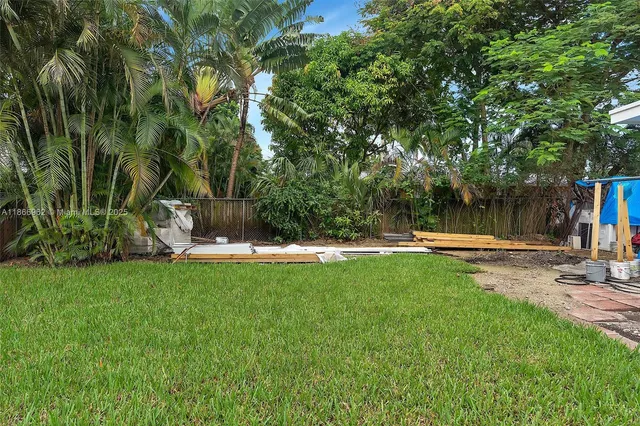 a bedroom with a bed and cabinets