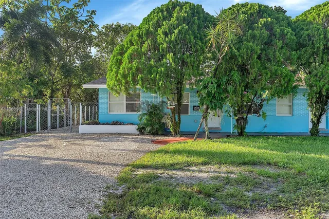 a bedroom with a bed and a chair
