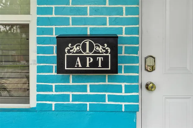 a view of house with garden and tall trees